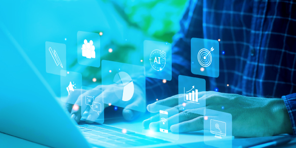 Person typing on a laptop with floating digital icons for analytics, AI, and marketing - case study on healthcare tech provider boosting revenue with Doceree admanager 