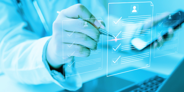 Healthcare professional marking digital checklist on a laptop screen - case study of healthcare publisher achieving 290% revenue growth with Doceree admanager 